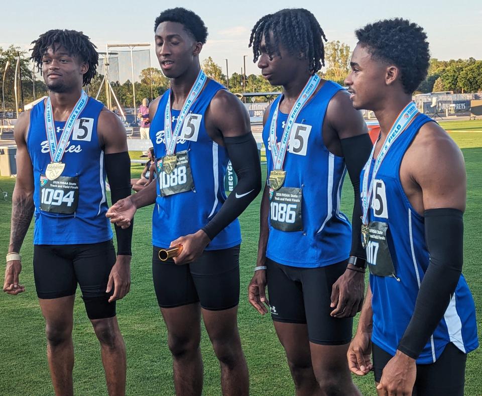 Bolles teammates Chase Collier, Simeon Caldwell, Naeem Burroughs and Santana Starks speak with reporters after winning the boys 4x100-meter relay during the FHSAA Class 2A high school track and field championships in Jacksonville on May 16, 2024. [Clayton Freeman/Florida Times-Union]