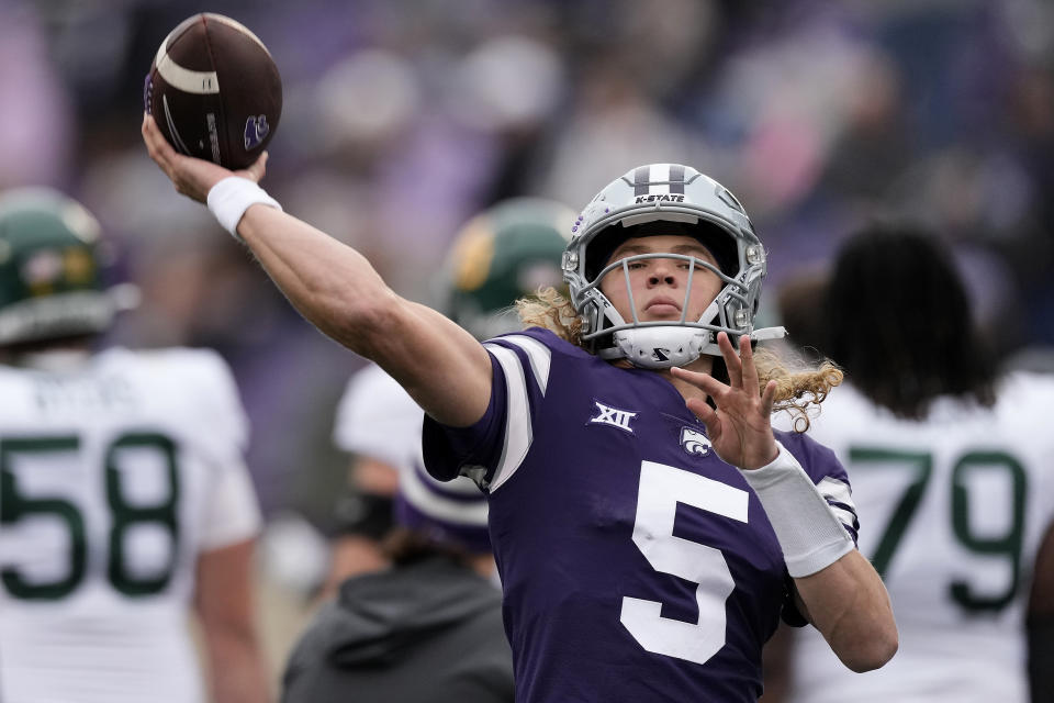 FILE - Kansas State quarterback Avery Johnson throws before an NCAA college football game against Baylor Saturday, Nov. 11, 2023, in Manhattan, Kan. No. 19 North Carolina State and Kansas State completed strong seasons this year to earn a trip to the Pop-Tarts Bowl,(AP Photo/Charlie Riedel, File)