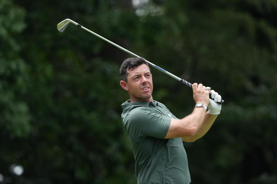 Ireland's Rory McIlroy tees off on the fourth hole during the third round.