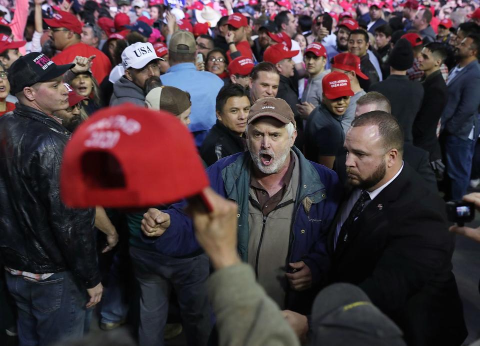 <p>A Trump supporter yells at protesters as they're removed from the rally in El Paso. </p>