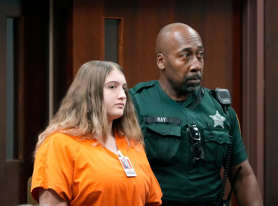 Nicole Jackson-Maldonado is lead into court during a hearing at the S. James Foxman Justice Center in Daytona Beach, Thursday, Sept. 15, 2022.