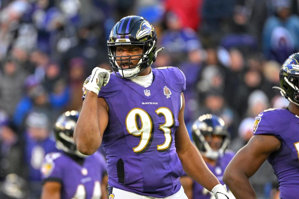 Baltimore Ravens defensive tackle Calais Campbell (93) gestures between plays during the second half of an NFL football game against the Carolina Panthers, Sunday, Nov. 20, 2022, in Baltimore. (AP Photo/Terrance Williams)