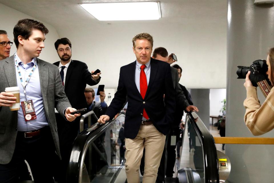 Sen. Rand Paul, R-Ky., takes an escalator in the U.S. Capitol on Friday.