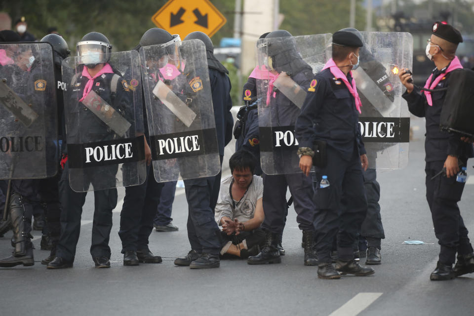 Riot policemen arrest an anti-government protester, during a protest in Bangkok, Thailand, Sunday, Feb. 28 , 2021. (AP Photo)