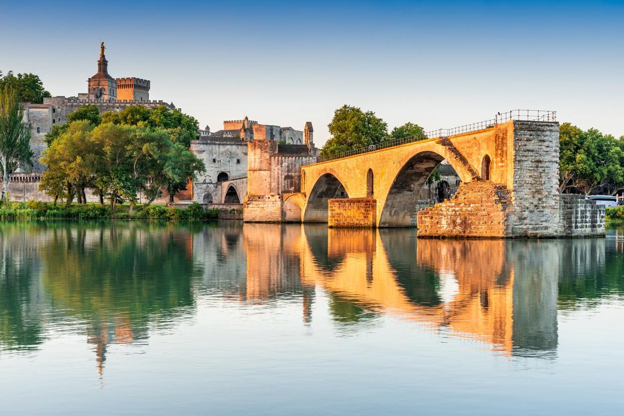 Avignon Bridge with Popes Palace and Rhone River at sunrise, Pont Saint-Benezet, Provence, France.