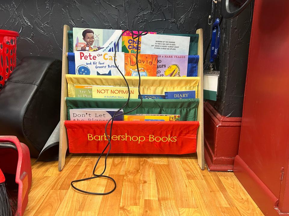 Among the titles at Iconic Barber in Philadelphia, courtesy of Barbershop Books: "The Adventures of Captain Underpants," "Pete the Cat and His Four Groovy Buttons" and "Chicka Chicka Boom Boom."