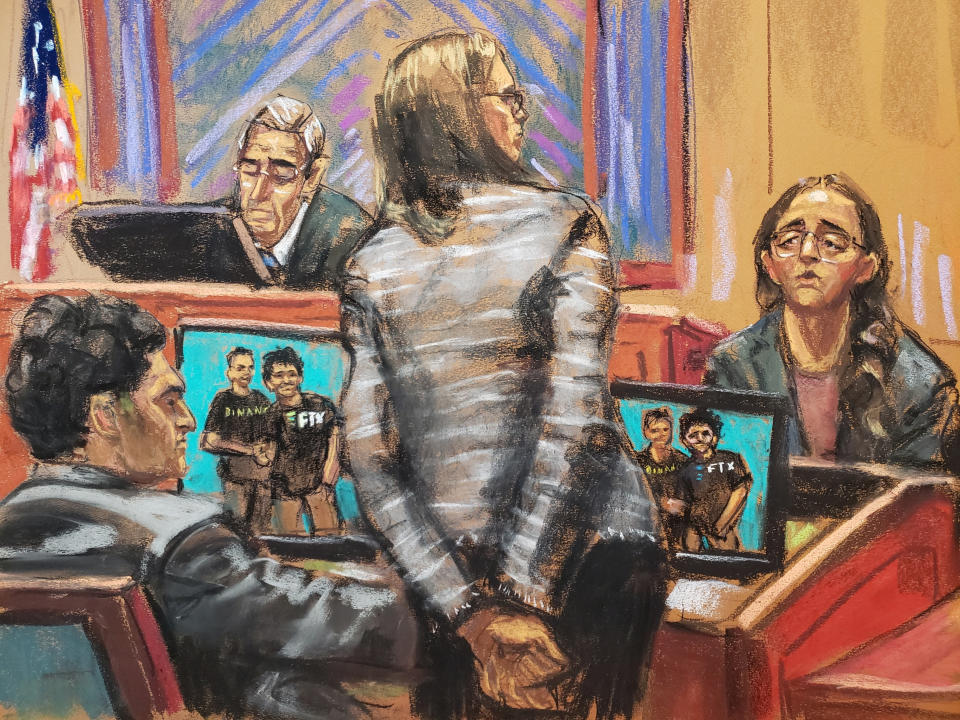 Assistant U.S. Attorney Danielle Sassoon questions Caroline Ellison in front of a screen showing Binance CEO Changpeng Zhao and Sam Bankman-Fried shaking hands, at Bankman-Fried's fraud trial before U.S. District Judge Lewis Kaplan over the collapse of FTX, the bankrupt cryptocurrency exchange, at Federal Court in New York City, U.S., October 10, 2023 in this courtroom sketch. REUTERS/Jane Rosenberg