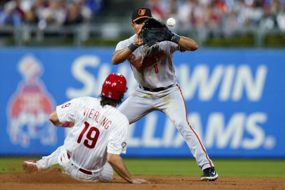 Baltimore Orioles shortstop Richie Martin, right, forces out Philadelphia Phillies' Matt Vierling at second base on a fielder's choice hit into by Didi Gregorius during the seventh inning of an interleague baseball game, Monday, Sept. 20, 2021, in Philadelphia. Gregorius was safe at first on the play. (AP Photo/Matt Slocum)