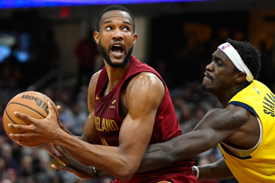 Apr 12, 2024; Cleveland, Ohio, USA; Cleveland Cavaliers forward Evan Mobley (4) looks to the basket beside Indiana Pacers forward Pascal Siakam (43) in the second quarter at Rocket Mortgage FieldHouse. Mandatory Credit: David Richard-USA TODAY Sports