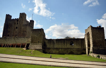 A man walks past Rochester Castle in Rochester, Britain, August 8, 2017. REUTERS/Hannah McKay