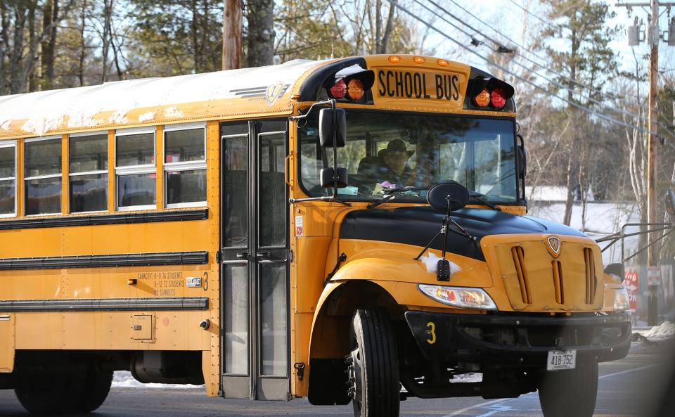 A school bus pulls out of the RSU 21 Transportation Office on York Street in Kennebunk during a driver's shortage Jan. 17, 2023.