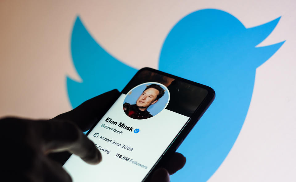 BRAZIL - 2022/11/24: In this photo illustration, the Elon Musk Twitter account seen displayed on a smartphone and Twitter logo in the background. (Photo Illustration by Rafael Henrique/SOPA Images/LightRocket via Getty Images)