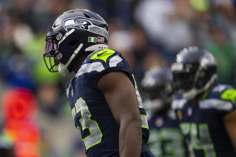 Seattle Seahawks linebacker Boye Mafe looks on.