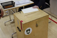 A vies of a Ballot box in a polling station in Gardabae, Iceland, Saturday, Sept. 25, 2021. Icelanders are voting in a general election dominated by climate change, with an unprecedented number of political parties likely to win parliamentary seats. Polls suggest there won’t be an outright winner on Saturday, triggering complex negotiations to build a coalition government. (AP Photo/Brynjar Gunnarsson)