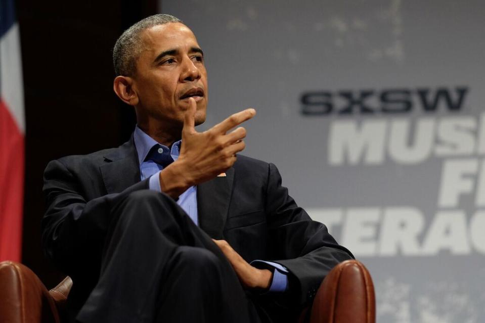 President Obama gestures on stage