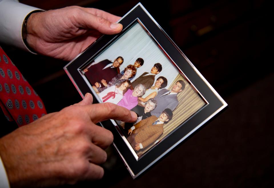Judge Wayne Trockman points to a family photo from the late 1960s in Evansville Thursday, Nov. 30, 2023.