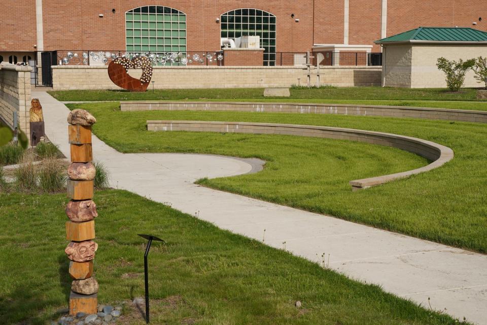 The Tecumseh High School Sculpture Garden has seating walls that were funded with an anonymous donation.