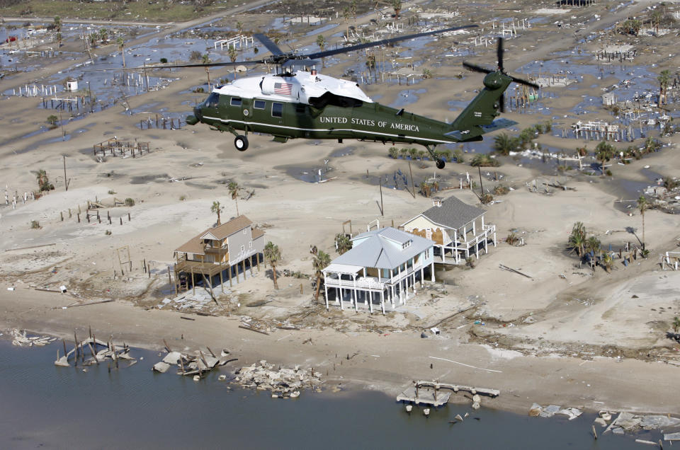 Marine One flies U.S. President George W. Bush over areas near Galveston, Texas, that were devastated by Hurricane Ike September 16, 2008. REUTERS/Kevin Lamarque   (UNITED STATES)