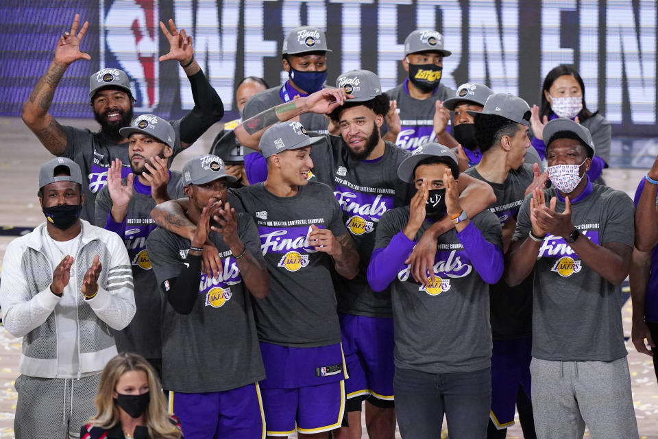 The Los Angeles Lakers celebrate after beating the Denver Nuggets in an NBA conference final playoff basketball game Saturday, Sept. 26, 2020, in Lake Buena Vista, Fla. The Lakers won 117-107 to win the series 4-1. (AP Photo/Mark J. Terrill)
