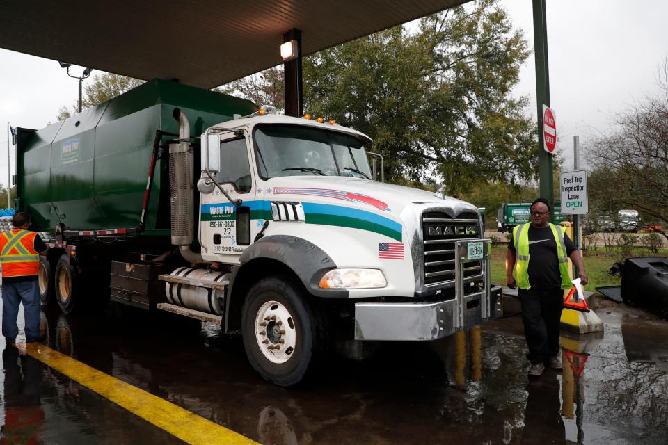 A Waste Pro garbage trucks pulls into the facility where it is checked for any maintenance or repairs needed before parking it for the day. 
