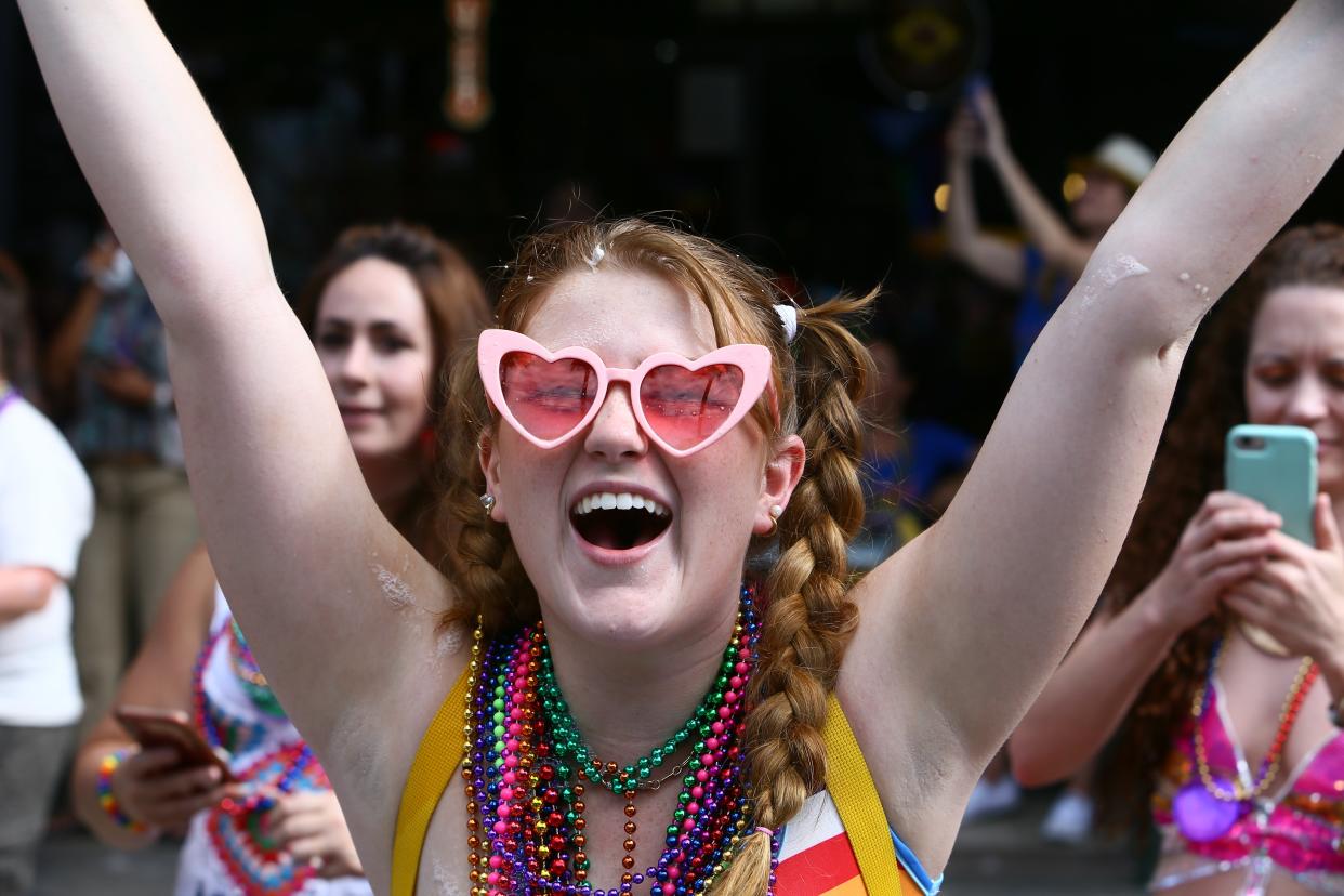 Remi Nelson, 19 of Brandon cheers for beads during the 2021 Tampa Pride Diversity Parade, on Saturday, May 22, 2021 in Ybor City, Florida. (Luis Santana/Tampa Bay Times via ZUMA Wire)