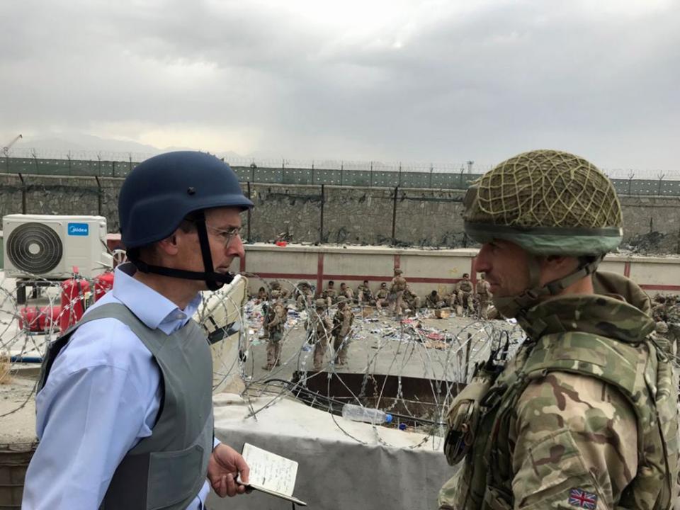 Sir Laurie Bristow, left, on the ground at Kabul airpot (FCO/PA) (PA Media)