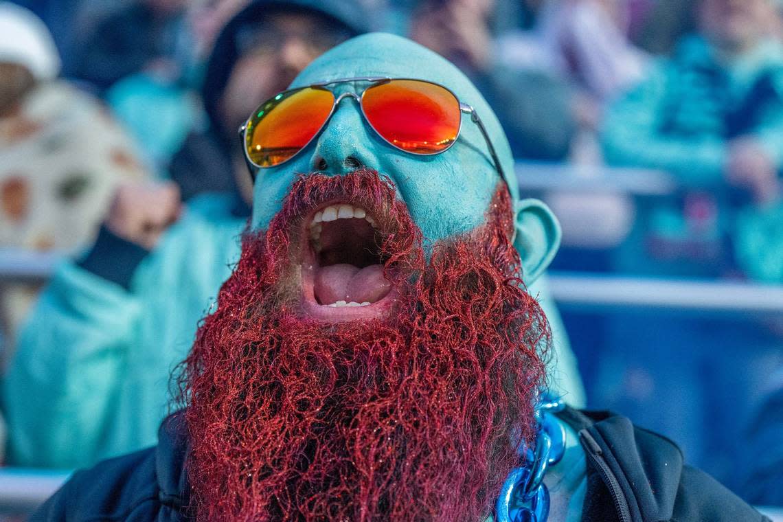 Richard Harper, adorned in Kansas City Current colors, with his face and beard painted to match, cheers as the Kansas City Current scores a goal in the second half during an NWSL game against Bay FC on Saturday, April 20, 2024, in Kansas City.