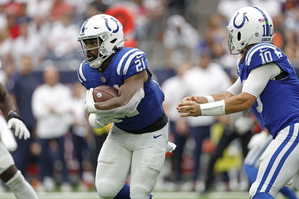 Indianapolis Colts running back Zack Moss takes the handoff from quarterback Gardner Minshew (10) during game against the Houston Texans, Sunday, Sep. 17, 2023, in Houston. | Tyler Kaufman, Associated Press