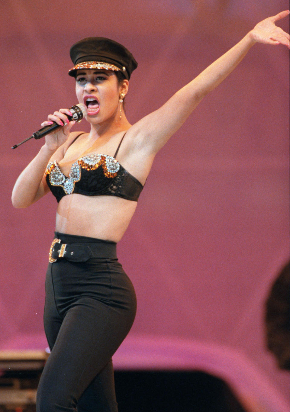 FILE - In this Feb. 28, 1993 file photo, singer Selena Quintanilla performs at the Houston Livestock Show and Rodeo inside the Astrodome in Houston. The new book “To Selena, With Love” written by Chris Perez, reveals intimate details about the late Tejano star's life. Quintanilla was shot and killed on March 31, 1995, two weeks shy of her 24th birthday. (AP Photo/Houston Chronicle, Dave Einsel, file)