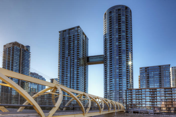Toronto, Canada - August 22, 2015: Toronto's CityPlace condominiums near Lake Ontario. CityPlace is a large residential development on land formerly owned by the railway. Shown are the buildings Parade )ne and Parade Two which have been connected by a sky bridge.