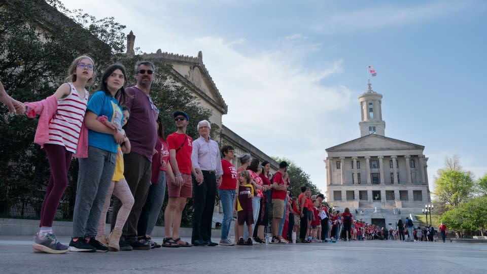 More than 10,000 people formed a human chain three miles long in March 2023 to advocate for gun safety reform. - George Walker IV/AP/File