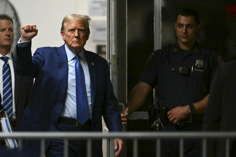 Former President Donald Trump gestures as he walks to the courtroom following a break in his trial at Manhattan criminal court Thursday, May 9, 2024, in New York. (Angela Weiss/Pool Photo via AP)