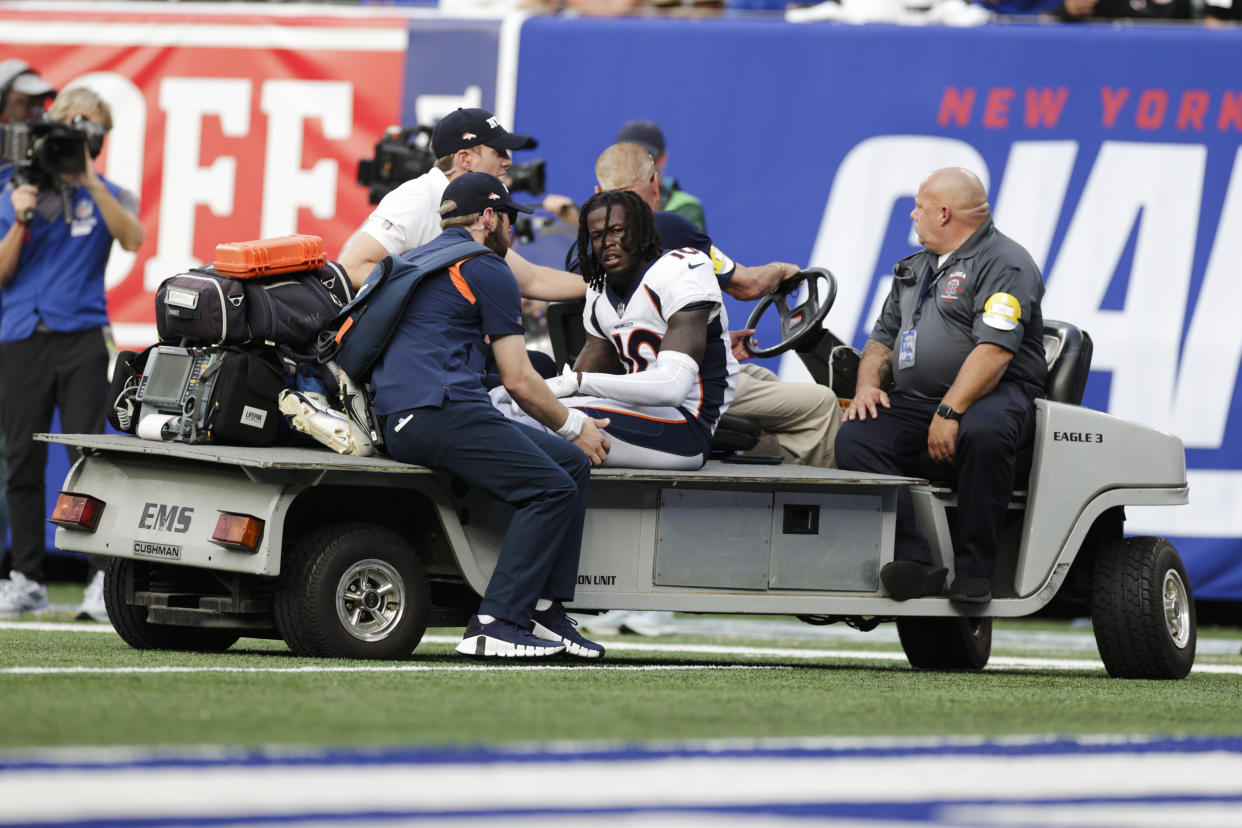 Denver Broncos wide receiver Jerry Jeudy (10) is carted off the field during the second half of an NFL football game against the New York Giants Sunday, Sept. 12, 2021, in East Rutherford, N.J. (AP Photo/Adam Hunger)