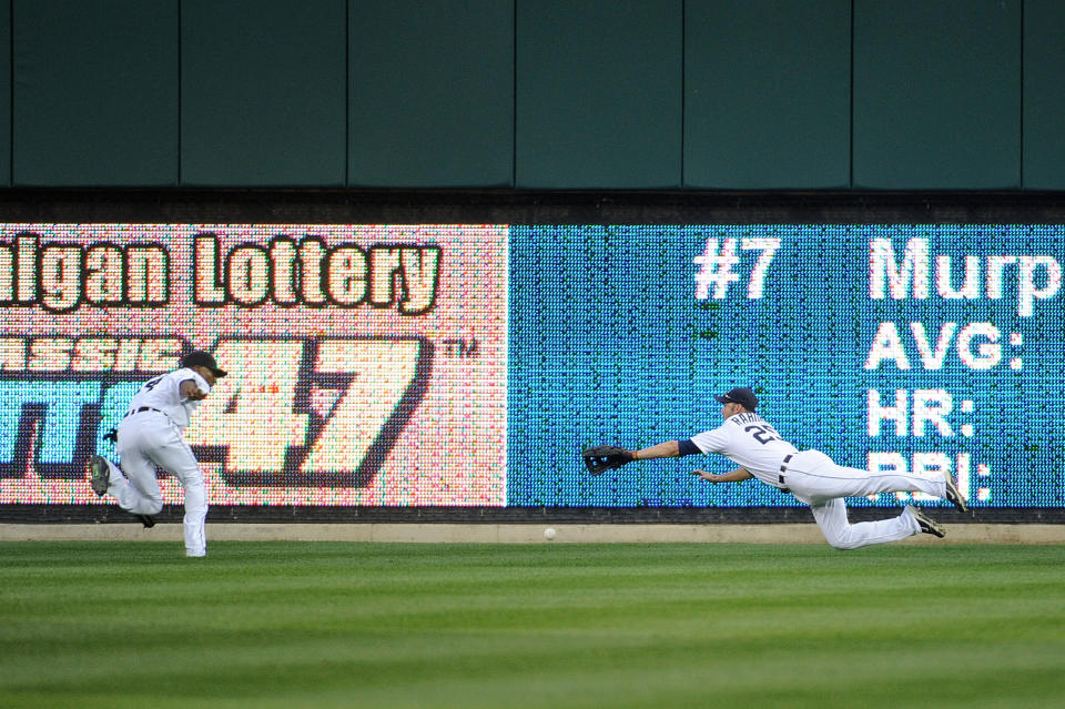 DETROIT, MI - OCTOBER 13: Ryan Raburn #25 of the Detroit Tigers fails to make a catch on a hit by David Murphy #7 of the Texas Rangers in the sixth inning of Game Five of the American League Championship Series at Comerica Park on October 13, 2011 in Detroit, Michigan. (Photo by Harry How/Getty Images)