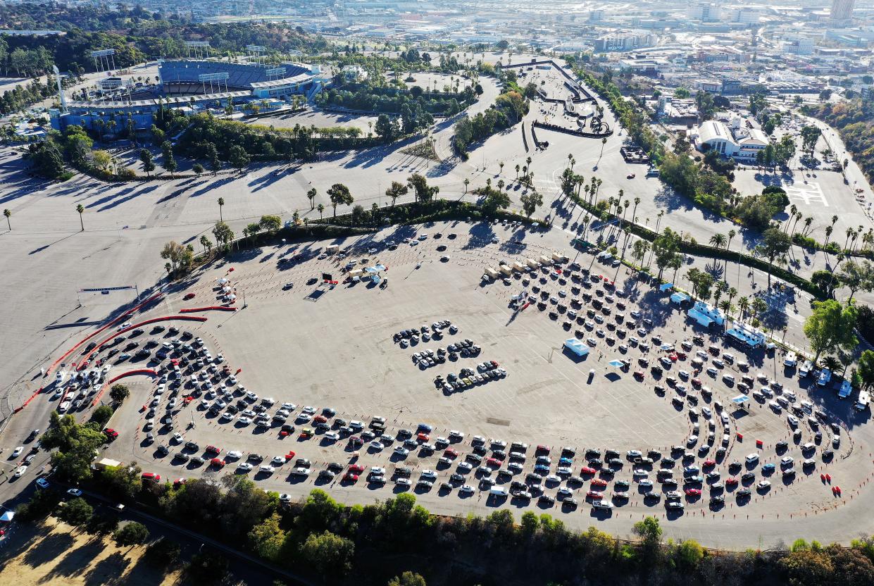 In an aerial view from a drone, cars are lined up at Dodger Stadium for COVID-19 testing on the Monday after Thanksgiving weekend on November 30, 2020, in Los Angeles, California. Health officials in Los Angeles County have issued a new limited stay-at-home order in effect for the next three weeks amid a surge in coronavirus cases.