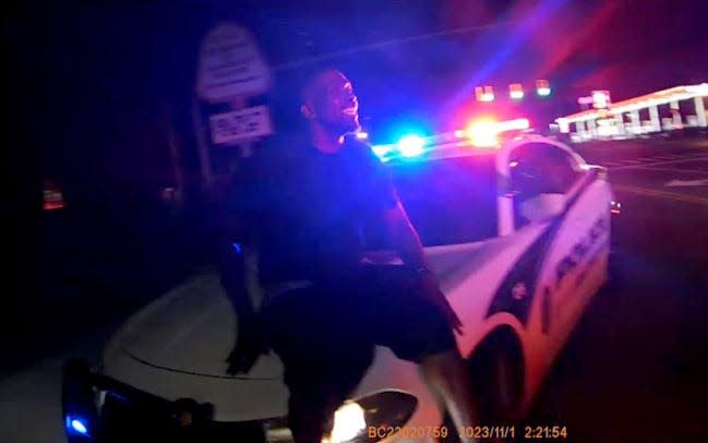 Video from Palmetto Police Department Officer Caleb Cottom's body-worn camera shows Breonte Johnson-Davis on the hood of Cottom's patrol car at 2:21am on Nov. 1, 2023.