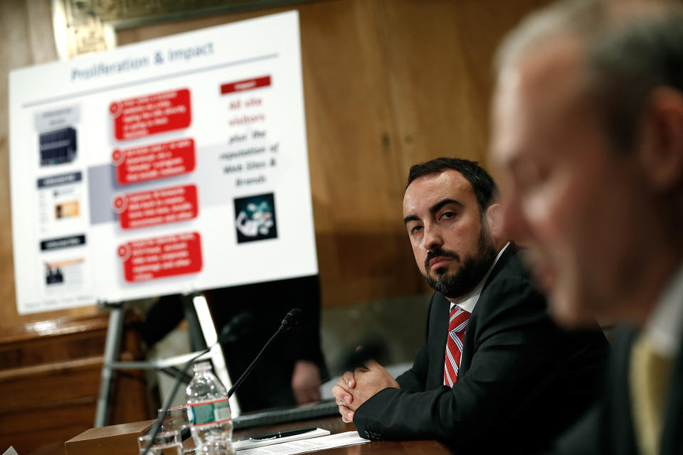 WASHINGTON, DC - MAY 15:  Alex Stamos, chief information security officer at Yahoo! Inc. (L) listens as Craig Spiezle (R), executive director, founder and president of the Online Trust Alliance testifies before the Senate Homeland Security Committee May 15, 2014 in Washington, DC. The committee heard testimony on the topic of on 'Online Advertising and Hidden Hazards to Consumer Security and Data Privacy.'  (Photo by Win McNamee/Getty Images)