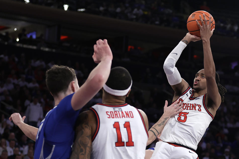 St. John's guard Daniss Jenkins (5) shoots against Creighton during the second half of an NCAA college basketball game, Sunday, Feb. 25, 2024, in New York. (AP Photo/Adam Hunger)