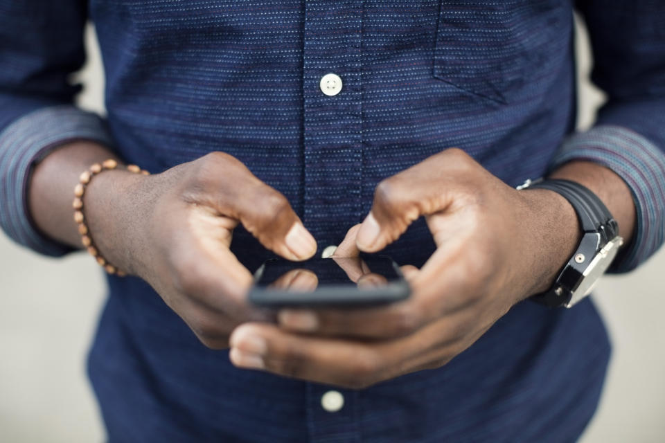 man texting on phone