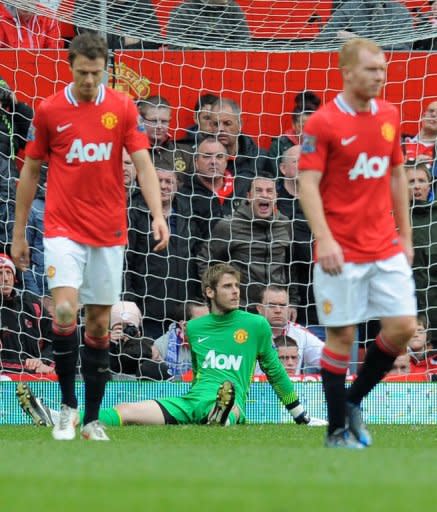 Manchester United's Dutch goalkeeper David de Gea (C) reacts after Everton's fourth goal during the English Premier League football match between Manchester United and Everton at Old Trafford in Manchester. The match ended in a 4-4 draw