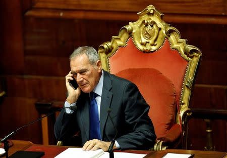 Upper house President Pietro Grasso speaks on the phone as he attends a session at the Senate in Rome, Italy December 7, 2016. REUTERS/Remo Casilli