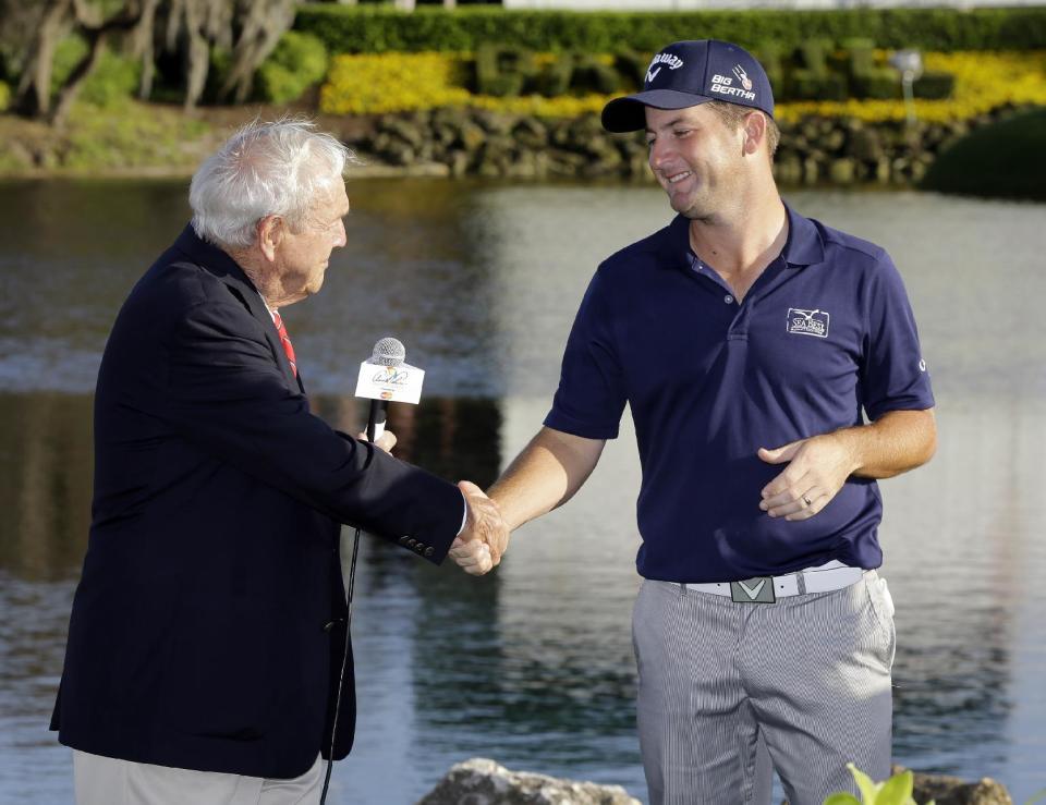 Matt Every, right, shakes hands with Arnold Palmer after winning the Arnold Palmer Invitational golf tournament at Bay Hill, Sunday, March 23, 2014, in Orlando, Fla. (AP Photo/Chris O'Meara)