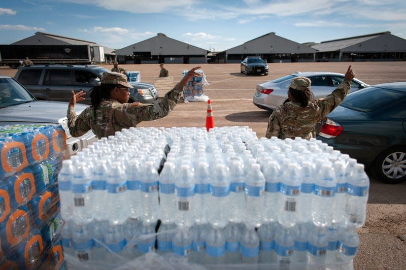 JACKSON, USA - September 1: Mississippi National Guard members direct traffic at a water distribution site at the Mississippi State Fairgrounds in Jackson, Mississippi on September, 1, 2022.