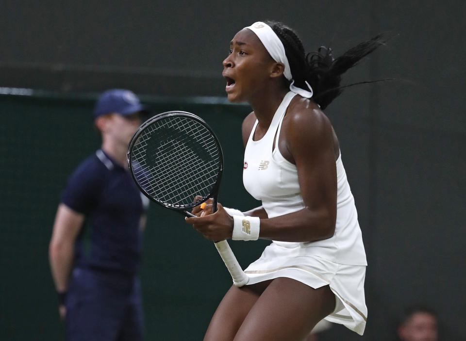 United States' Cori "Coco" Gauff celebrates after beating Slovakia's Magdalena Rybaikova in a Women's singles match during day three of the Wimbledon Tennis Championships in London, Wednesday, July 3, 2019. (AP Photo/Alastair Grant)