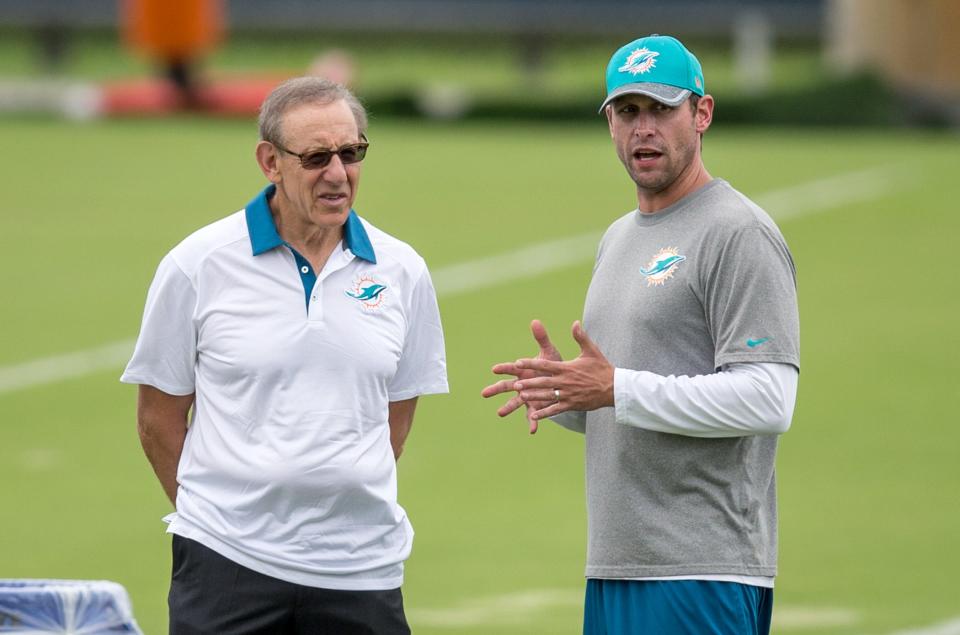 Miami Dolphins team owner Stephen Ross and head coach Adam Gase watch Dolphins organized team activities in Davie, Florida on June 9, 2016.