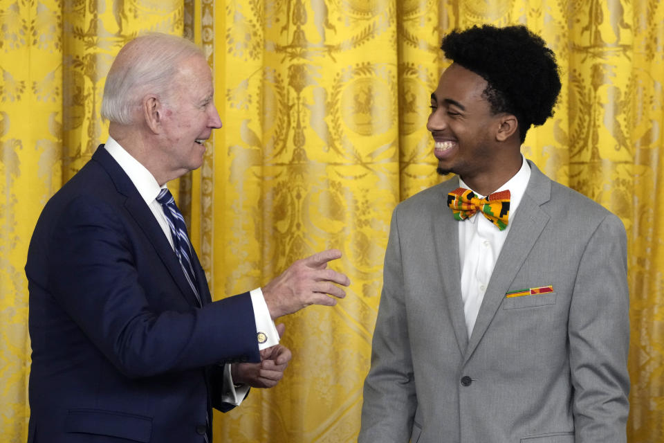 President Joe Biden takes with DuWayne Portis Jr., a youth leader at Chicago Youth Service Corps and a high school senior at Lindblom Math and Science Academy, before speaking at an event to celebrate Black History Month, Monday, Feb. 27, 2023, in the East Room of the White House in Washington. (AP Photo/Alex Brandon)