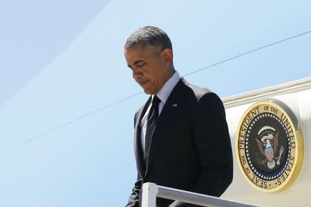 U.S. President Barack Obama disembarks from Air Force One as he arrives at Los Angeles International Airport in Los Angeles, California, July 23, 2014. REUTERS/Larry Downing