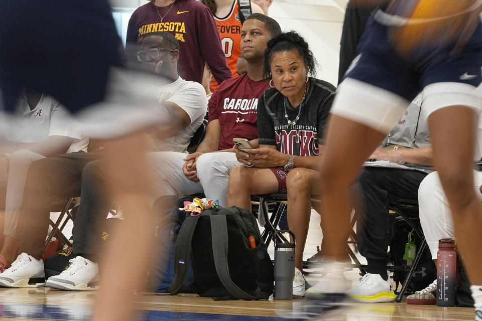 South Carolina women's basketball coach Dawn Staley, right, watches players of the 2023 U.S.A. 3x3 Basketball U17 National Team practice at the NCAA College Basketball Academy, Friday, July 28, 2023, in Memphis, Tenn. (AP Photo/George Walker IV)