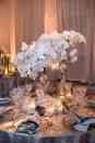 <p>If you’re worried about matching your centerpiece with the rest of your colorful Christmas decor, remember that white flowers are typically a safe bet for the holidays. Here, towering blooms are illuminated by clusters of glowing candles. </p><p><em>Via </em><a href="http://www.kristinbanta.com/" rel="nofollow noopener" target="_blank" data-ylk="slk:Kristin Banta Events;elm:context_link;itc:0;sec:content-canvas" class="link "><em>Kristin Banta Events</em></a></p>