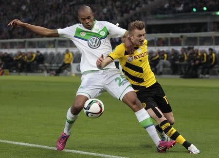 VfL Wolfsburg's Naldo (L) fights for the ball with Borussia Dortmund's Marco Reus during their German Cup (DFB Pokal) final soccer match in Berlin, Germany, May 30, 2015. REUTERS/Ina Fassbender